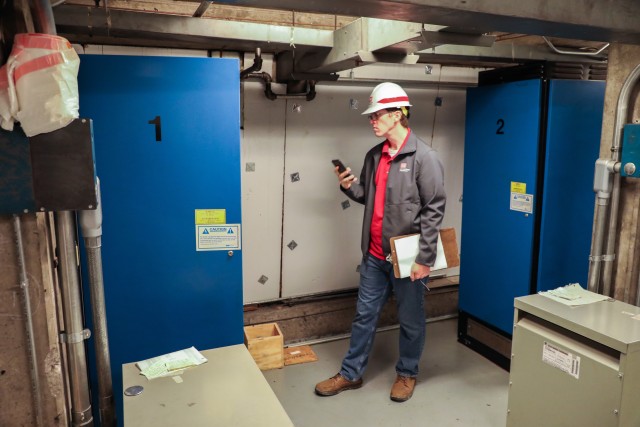 Brian Adkins, electrical engineer, U.S. Army Corps of Engineers – Omaha District, documents the elevator controls during a site assessment of a building in Omaha, Neb., the state is considering turning into an alternate care facility in the...