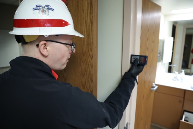 Andy Temeyer, architect, U.S. Army Corps of Engineers – Omaha District, uses a laser ranger finder to measure the width of a bathroom doorway during a site assessment April 6, of a building in Omaha, Neb., the state is considering turning into...