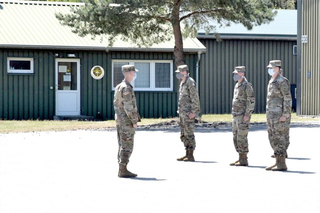 Advanced Individual Training Soldiers practice their close order drill in the U.S. Army Garrison Rheinland-Pfalz Deployment Processing Center. AIT Soldiers on their way to their assignments throughout Germany are being housed by USAG RP for their 14 day quarantine period, as required by the host nation.