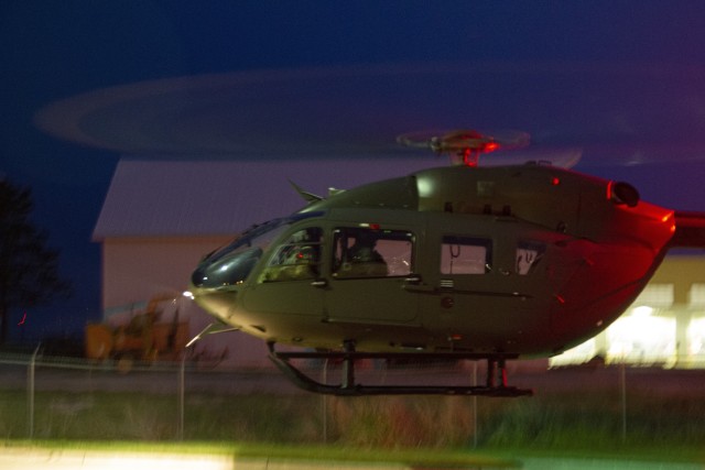 An Iowa Army National Guard UH-72 Lakota helicopter departs the Iowa National Guard Readiness Center in Iowa City, Iowa, after transferring COVID-19 test kits on May 4, 2020. The helicopter transported the test kits from a Test Iowa site in Sioux City to the State Hygienic Laboratory in Coralville, Iowa. (U.S. Army National Guard photo by Cpl. Samantha Hircock)