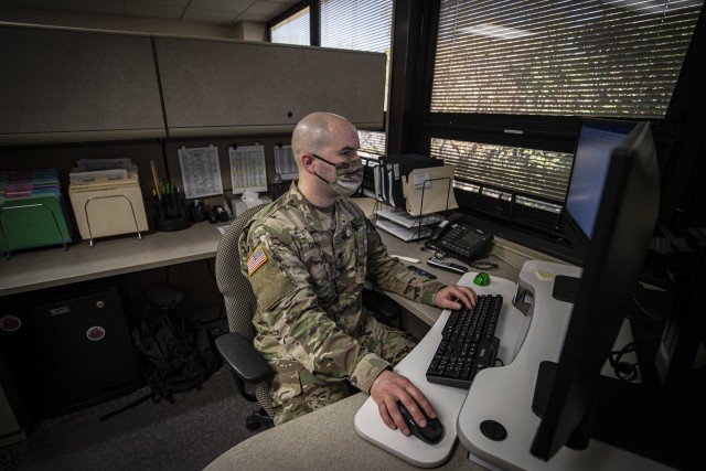 U.S. Army Spc. Benjamin Castria works in the New Jersey National Guard’s Joint Operations Center in the Homeland Security Center of Excellence, Lawrenceville, N.J., April 22, 2020. New Jersey Soldiers and Airmen, as well as active duty and civilians from U.S. Northern Command are working together in the center to support the state’s response efforts to COVID-19. 
