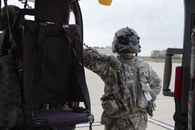 Sgt. Jason Humke, a helicopter maintainer with Company A, 1st Battalion, 376th Aviation Security and Support, Iowa Army National Guard, performs pre-flight operations of a UH-72 Lakota helicopter before a mission in Waterloo, Iowa, on May 4, 2020. COVID-19 test kits from a Test Iowa site in Sioux City, Iowa, were transported by helicopter to the State Hygienic Laboratory in Coralville, Iowa. (U.S. Army National Guard photo by Cpl. Samantha Hircock)