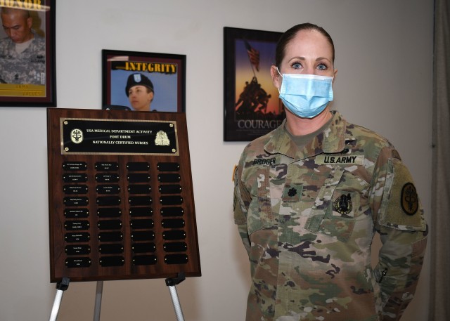 FORT DRUM, N.Y. – Lt. Col. Kristine Broger, the deputy commander for nursing, U.S. Army Medical Department Activity (MEDDAC), Fort Drum, N.Y., stands next to a plaque commemorating the MEDDAC’s nationally board-certified nurses during the...