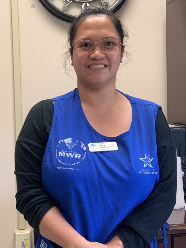 Amy Crawford, lead child and youth program assistant at Eagles Child Development Center, enjoys taking care of children, but now she is helping take care of mission essential Soldiers, civilians and their Families, too. When guidance was announced...