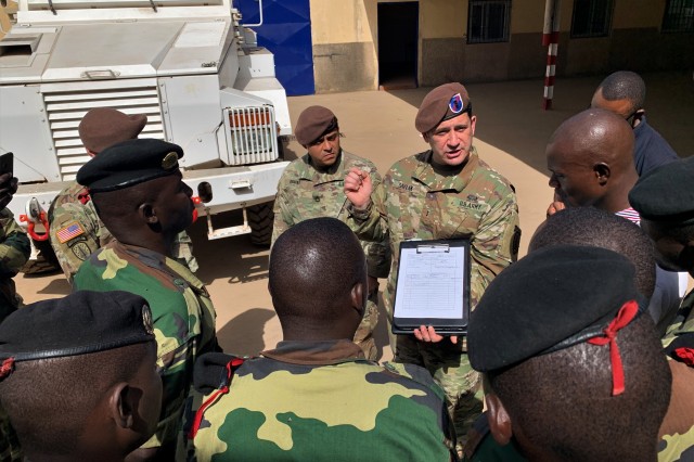 Chief Warrant Officer 3 Yagmur Saylak, Logistics Advisor Team 1610, 1st Security Force Assistance Brigade, teaches a group of Senegalese soldiers how to complete a vehicle inspection form, March 5, 2020, in Dakar, Senegal. LAT 1610 is teaching a class on preventative vehicle maintenance and vehicle recovery to their military partners in Senegal.