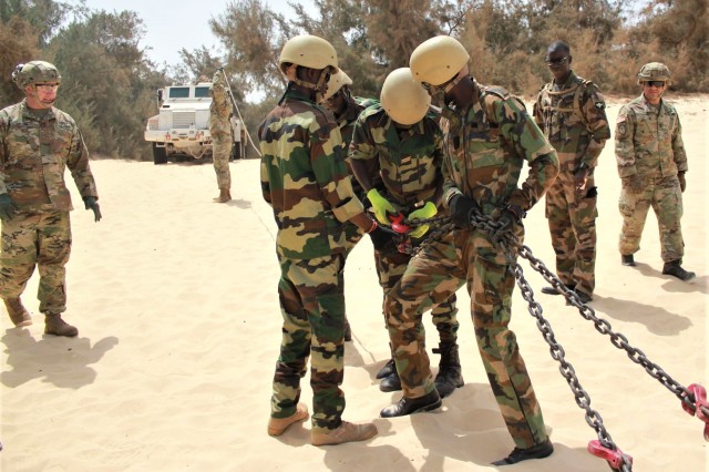 Advisers from Logistics Advisor Team 1610, 1st, SFAB, and soldiers from the Senegal Armed Forces work side by side during vehicle recovery training March 12, 2020, in Dakar, Senegal. LAT 1610 is conducting training on preventative vehicle...
