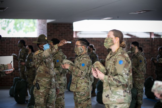 Newly arrived trainees to 2nd Battalion, 60th Infantry Regiment meet their
drill sergeants and receive instruction for wearing cloth face coverings
throughout their future training. Each trainee has been in quarantine for
two weeks before arriving to their training units to complete Basic Combat
Training. As part of the newly implemented 2 + 8 training measures, trainees
will be closely monitored for an additional two weeks to ensure they aren’t
exposed to the COVID-19 virus. Wake-up routines for trainees now include
personal hygiene, cleaning and sanitization of their living spaces and daily
temperature checks. (Photo by Saskia Gabriel)