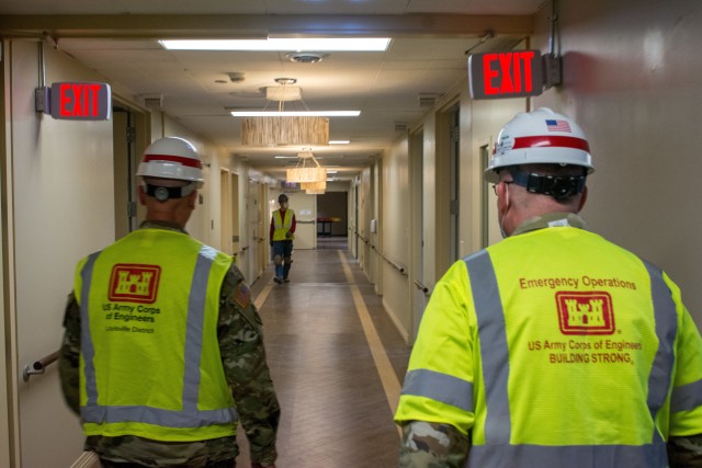 Left, Sgt. Maj. John Nelson. Nelson, a U.S. Army Reserve Soldier from the 416th Theater Command supporting U.S. Army Corps of Engineers project to rehabilitate Westlake Hospital in Melrose, Ill. into an alternate care facility (ACF) during the COVID-19 pandemic, walk the halls with Sgt. Maj. Steven Lotz from the 86th training division, as they provide quality control to the project, April 23, 2020 (U.S. Army photo by Sgt. 1st Class Jason Proseus/416th TEC).