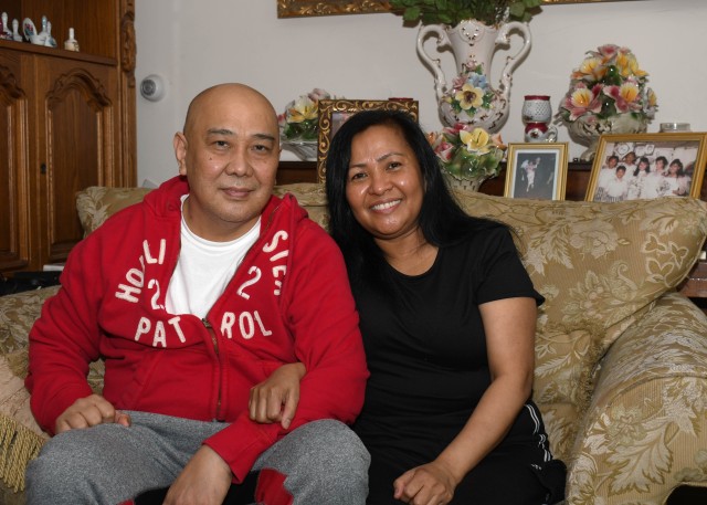Retired U.S. Army Sgt. Luis Luce sits with his wife, Analyn Luce, at their home in Watertown, N.Y. May 4, 2020. In early April, Luis was diagnosed with COVID-19. Shortly after, he had to be placed on a ventilator at the Samaritan Medical Center in...