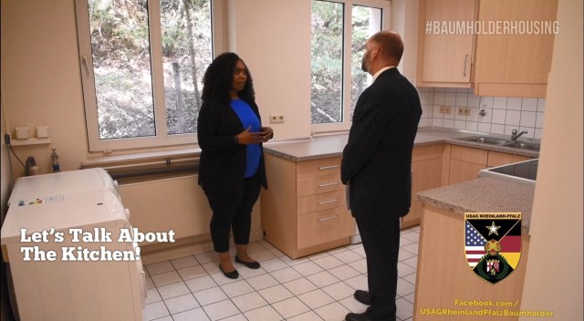 A screen capture shows a scene from the "Let's Talk Housing" video produced by U.S. Army Garrison Rheinland-Pfalz in September 2019. The video offers a virtual tour of a Baumholder Military Community housing unit with Deputy Garrison Manager Jim...