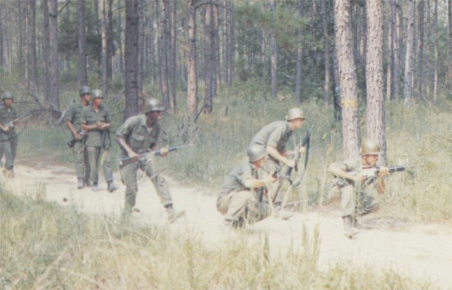 Soldiers with Delta Company, 1st Battalion, 1st Basic Combat Training Brigade, look for an ambush as they move out the the Fort Polk training area in April, 1974.