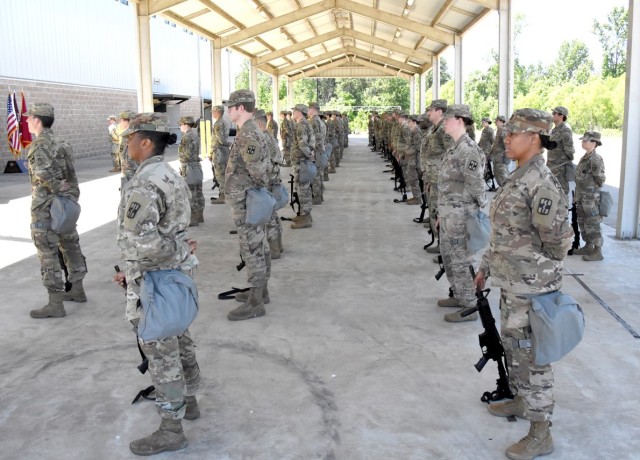 Soldiers from the Joint Readiness Training Center and Fort Polk’s 115th Field Hospital, 32nd Hospital Center, participate in a deployment ceremony May 6 prior to leaving in support of  Task Force Evacuare.