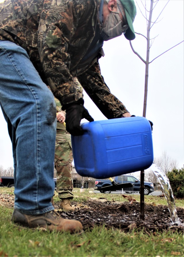 Garrison staff members, all practicing social distancing and other protective measures, plant a tree during the installation’s 2020 Arbor Day observance April 24, 2020, at Fort McCoy, Wis. For the ceremony held in front of McCoy’s Community...