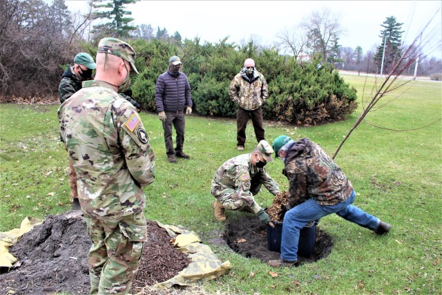 Garrison staff members, all practicing social distancing and other protective measures, plant a tree during the installation’s 2020 Arbor Day observance April 24, 2020, at Fort McCoy, Wis. For the ceremony held in front of McCoy’s Community...