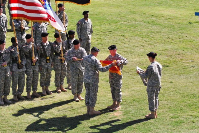 Maj. Gen. Terry A. Wolff (right), 1st Armored Division, outgoing commander, and Gen. James D. Thurman, commanding general U.S. Army Forces Command, uncase the 1AD colors, officially returning the last U.S. armored division to U.S. soil after more than 40 years during a ceremony at Fort Bliss Noel Field, May 24 2011. (U.S. Army Photo by Sergeant 1st Class by Eric Abendroth)