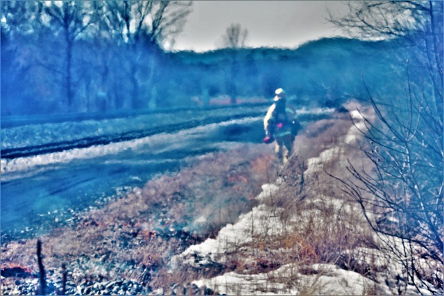 A Fort McCoy, Wis., prescribed burn team member oversees a prescribed burn March 4, 2020, along the railroad tracks on South Post at the installation. The post prescribed burn team includes personnel with the Fort McCoy Directorate of Emergency...