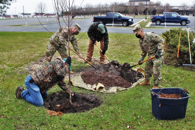 Garrison staff members, all practicing social distancing and other protective measures, plant a tree during the installation’s 2020 Arbor Day observance April 24, 2020, at Fort McCoy, Wis. For the ceremony held in front of McCoy’s Community...