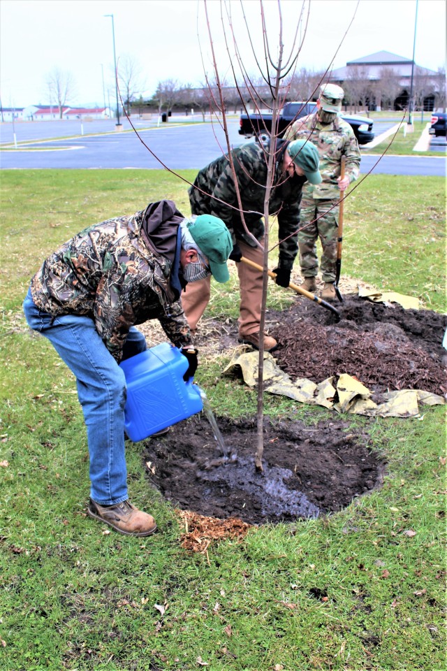 Garrison staff members, all practicing social distancing and other protective measures, plant a tree during the installation’s 2020 Arbor Day observance April 24, 2020, at Fort McCoy, Wis. For the ceremony held in front of McCoy’s Community...