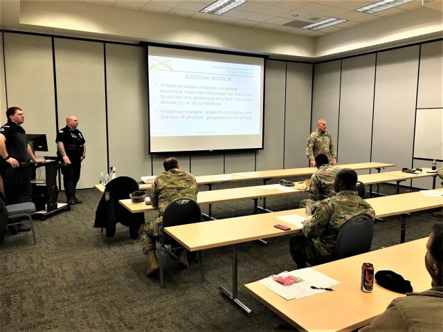 Soldiers are socially distanced while participating in augmented standby force training with the Directorate of Emergency Services Police Department on April 13, 2020, at Fort McCoy, Wis. Twenty-four Fort McCoy Soldiers received training to...