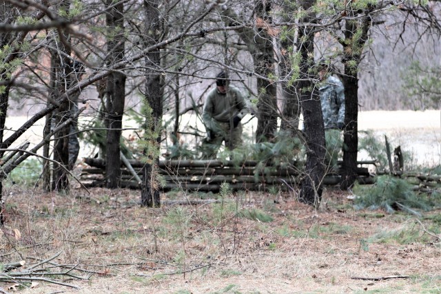 Students in Cold-Weather Operations Course (CWOC) Class 20-05 set up a bivouc area that includes an Arctic 10-person tent at a bivouac area during training March 16, 2020, on North Post at Fort McCoy, Wis. CWOC students are trained on a variety of...