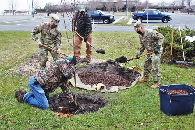Garrison staff members, all practicing social distancing and other protective measures, plant a tree during the installation’s 2020 Arbor Day observance April 24, 2020, at Fort McCoy, Wis. For the ceremony held in front of McCoy’s Community...