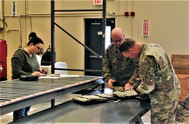 Warehouse Specialist Ashley Birks with the Fort McCoy Central Issue Facility completes sizing training with Soldiers with the 181st Multi-Functional Training Brigade on Feb. 12, 2020, at the facility at Fort McCoy, Wis. Four noncommissioned...