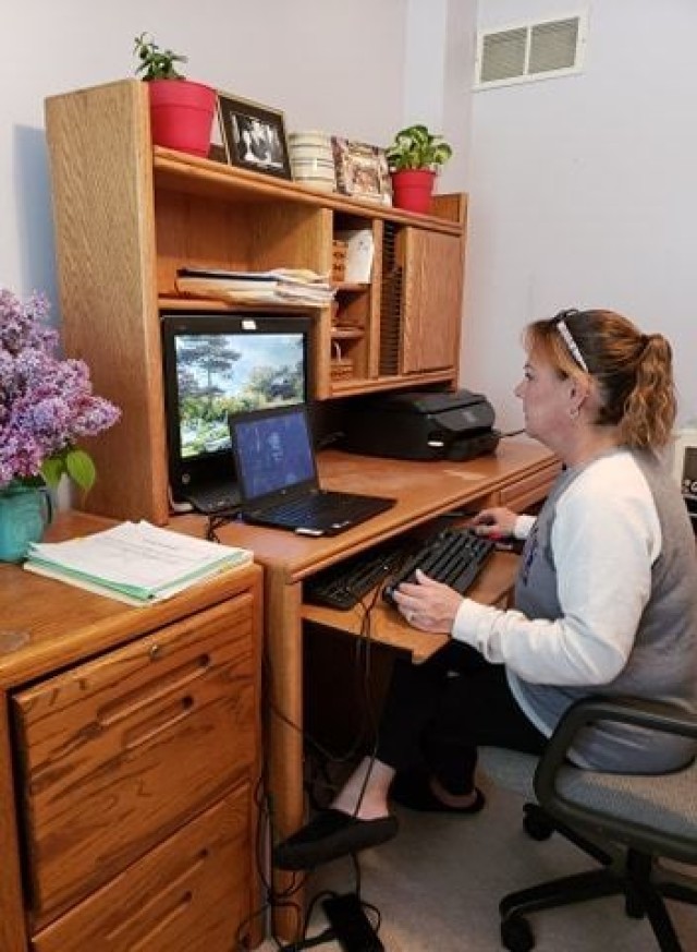 Teresa Sullivan, a First Army management analyst, does her job from home. Because of the COVID-19 pandemic, about two-thirds of the First Army headquarters workforce is teleworking.