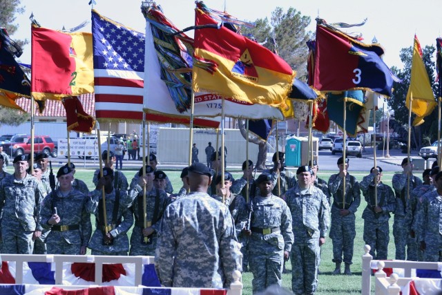 The incoming 1st Armored Division commander, Maj. Gen. Dana J. H. Pittard stands before his new troops and the 1st Armored Division colors during an color uncasing ceremony on May 24, 2011 at Noel Parade Field. The ceremony marked the official...