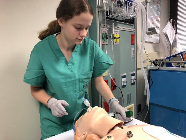 Amber Miller, youth volunteer, works in the Simulation Center at Brooke Army Medical Center, Fort Sam Houston, Texas, July 9, 2019. Miller hopes to inspire others to donate blood during the COVID-19 crisis. (U.S. Army photo by Jason W. Edwards)