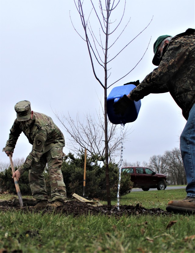Garrison staff members, all practicing social distancing and other protective measures, plant a tree during the installation’s 2020 Arbor Day observance April 24, 2020, at Fort McCoy, Wis. For the ceremony held in front of McCoy’s Community...
