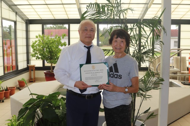 Deputy to the Garrison Commander James A. Chen presents an Army certificate of appreciation Sept. 20, 2019, on behalf of the Fort McCoy Garrison to Aiko Timm at Rumpel Fitness Center at Fort McCoy, Wis. Timm was recognized for her continuous...