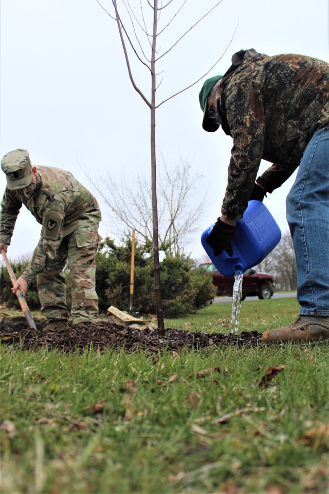 Garrison staff members, all practicing social distancing and other protective measures, plant a tree during the installation’s 2020 Arbor Day observance April 24, 2020, at Fort McCoy, Wis. For the ceremony held in front of McCoy’s Community...