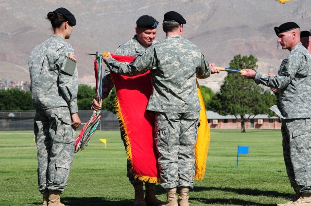 Maj. Gen. Terry A. Wolff (right), 1st Armored Division, outgoing commander, and Gen. James D. Thurman, commanding general U.S. Army Forces Command, uncase the 1AD colors, officially returning the last U.S. armored division to U.S. soil after more than 40 years, during the 1st Armored Division Change of Command ceremony at Fort Bliss Noel Field, May 24. The ceremony officially appoints Pittard the commanding general of Fort Bliss and the 1AD and announces the reflagging of 1AD to U.S. soil after more than 40 years. (U.S. Army photo by Staff Sgt Melissa Parrish)