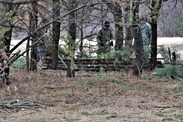 Students in Cold-Weather Operations Course (CWOC) Class 20-05 set up a bivouc area that includes an Arctic 10-person tent at a bivouac area during training March 16, 2020, on North Post at Fort McCoy, Wis. CWOC students are trained on a variety of...