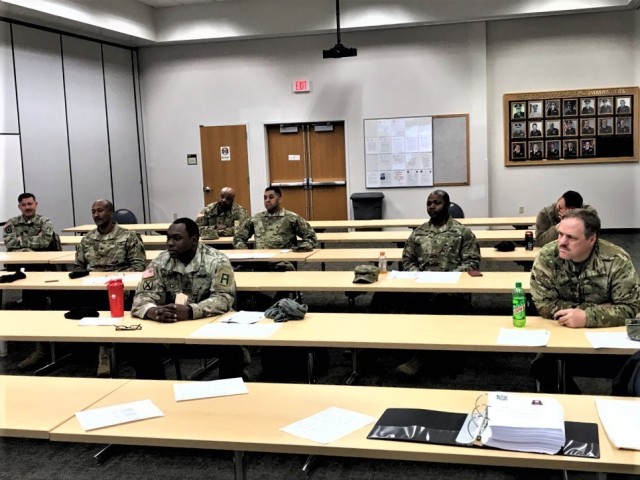 Soldiers are socially distanced while participating in augmented standby force training with the Directorate of Emergency Services Police Department on April 13, 2020, at Fort McCoy, Wis. Twenty-four Fort McCoy Soldiers received training to...