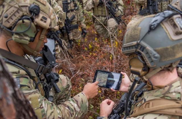 Members of the 6th Special Operations Squadron use a tablet running Tactical Assault Kit to upload coordinates during an exercise showcasing the capabilities of the Advanced Battle Management System at Duke Field, Florida, on Dec. 17, 2019. 