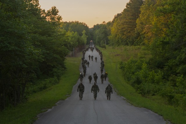 &#34;And the Army goes rucking along!&#34; 1st Regiment, Advanced Camp, Cadets and Cadre complete the 12-mile Ruck March as a company on June 22 at Fort Knox, Ky. The 12-mile Ruck March is the last event Cadets must complete before graduation.