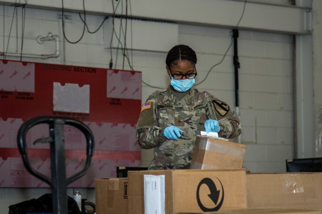 Pvt. Anika Gatherright, 62nd Quartermaster Company, 553rd Combat Sustainment Support Battalion, 1st Cavalry Division Sustainment Brigade, re-labels a part at the Wagonmaster supply support activity warehouse, Fort Hood, Texas, April 29, 2020. (U.S. Army Photo by Sgt. Calab Franklin)