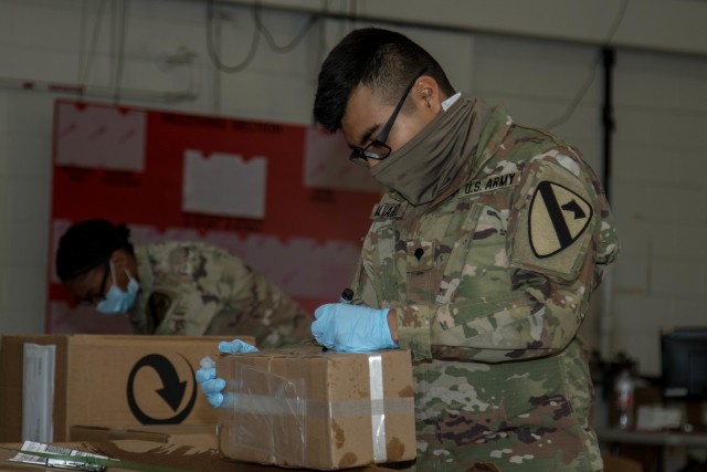 Spc. Giovanni Alverez, 62nd Quartermaster Company, 553rd Combat Sustainment Support Battalion, 1st Cavalry Division Sustainment Brigade, labels a part at the Wagonmaster supply support activity warehouse, Fort Hood, Texas, April 29, 2020. (U.S. Army Photo by Sgt. Calab Franklin)