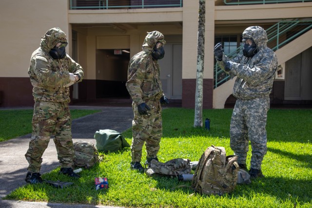 Soldiers don their gear as part of clean team training at Schofield Barracks, Hawaii, May 5, 2020. The base cleaning team is a precautionary force established to fight the spread of COVID-19 and protect the health and wellness of Soldiers. 
