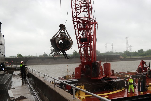 U.S. Army Corps of Engineers, Tulsa District maintenance crews working on the McClellan Kerr Arkansas River Navigation System, clean debris from the downstream side of the Webbers Falls powerhouse May 12, 2020.  Removing the debris helps ensure...