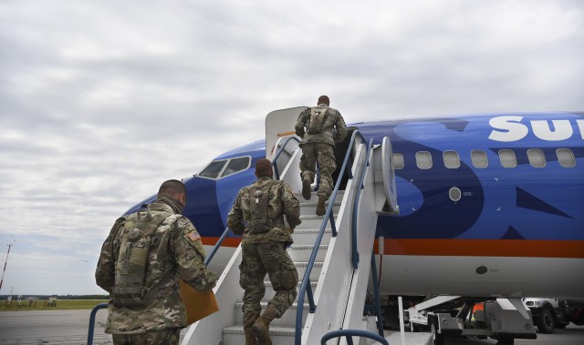 Recently graduated basic combat trainees board a chartered plane that will deliver them safely to Fort Sam Houston, Texas, May 8. Through mutual coordination efforts between Training and Doctrine Command and the post, the clean and disinfected...