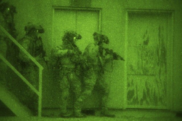 U.S. Air Force Special Tactics Airmen prepare to enter a building in search of a high value individual during exercise Southern Strike 2020, at Camp McCain Training Center, Miss., Feb. 3, 2020. Southern Strike is a large-scale, joint and...