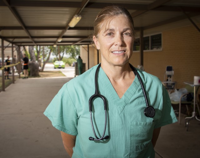 U.S. Army Col. April Critelli, physician assistant, prepares to end her work day at the McWethy Troop Medical Clinic, Fort Sam Houston, Texas, May 13, 2019. Critelli is the first medical Soldier to return to active duty from retirement during the COVID-19 crisis. 