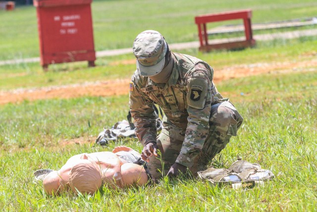 Pfc. Nguessan Abbe, Company D., 2nd Battalion, 327th Infantry Regiment “No Slack”, 1st Brigade Combat Team “Bastogne”, 101st Airborne Division (Air Assault), demonstrates medical-treatment procedures on a medical dummy to Soldiers preparing for a hands-on portion of the Combat Life Saver Qualification test on Fort Campbell, Ky., May 7. Soldiers from 2-327 Inf. Regt. attained CLS qualifications in preparation for the brigade’s future deployment to Joint Readiness Training Center this fall at Fort Polk, La. (U.S. Army photo by Maj. Vonnie Wright)
