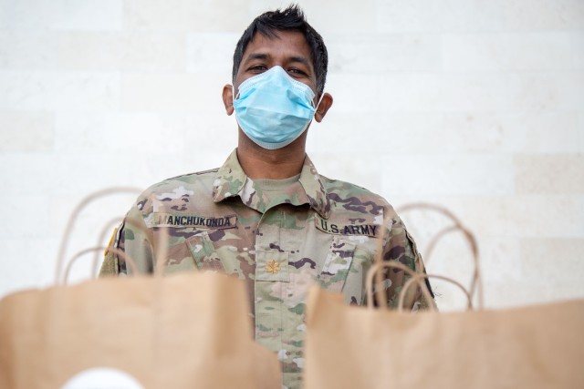 Army Maj. Rajeev Manchukonda, assigned to the Jacobi Medical Center in the Bronx, New York, distributes meals to medical personnel in support of the Department of Defense COVID-19 response, April 28, 2020. U.S. Northern Command, through U.S. Army North, is providing military support to the Federal Emergency Management Agency to help communities in need. 