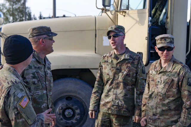 U.S. Army Reserve truck drivers with the 724th Transportation Company out of Bartonville, Illinois, share a laugh at Powidz Air Base, Powidz, Poland, before departing on a ring mount mission April 28 . The 724th is deployed to Poland, where they transport fuel and supplies to Army base camps throughout the country. (U.S. Army Reserve photo by Master Sgt. Ryan C. Matson, 652nd Regional Support Group)