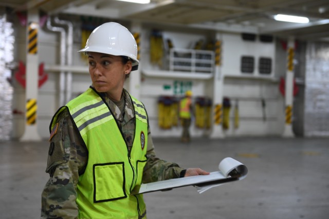 Sgt. Amanda Rovillo, 352nd Expeditionary Terminal Operations Element movement non-commissioned officer, inventories and verifies stow position of military vehicles on board the Liberty Passion at Naval Weapons Station, Joint Base Charleston in Support of DEFENDER-Europe 20 March 10, 2020. The United States Army Reserve unit is part of the Military Surface Deployment and Distribution Command’s total force team participating in the DEFENDER-Europe 20 exercises, deploying a division-size combat-credible force from the United States to Europe. 