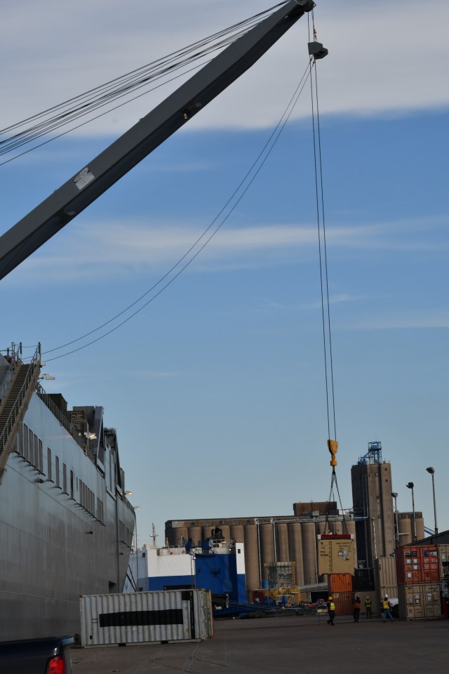 Members of the lift gang at the Port of Beaumont, Texas simultaneously perform lift-on/lift-off operations on the ground and deck of the Bob Hope-class roll-on/roll-off ship USNS Benavidez Feb. 22, 2020 in support of DEFENDER-Europe 20. The ship will carry military equipment to the European theater as part of almost 6,000 pieces of cargo that the Military Surface Deployment and Distribution Command will process through ports in the Gulf of Mexico. 