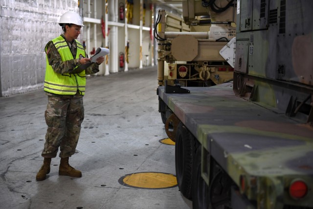 Sgt. Amanda Rovillo, 352nd Expeditionary Terminal Operations Element movement non-commissioned officer, inventories and verifies stow position of military vehicles on board the Liberty Passion at Naval Weapons Station, Joint Base Charleston in Support of DEFENDER-Europe 20 March 10, 2020. The United States Army Reserve unit is part of the Military Surface Deployment and Distribution Command’s total force team participating in the DEFENDER-Europe 20 exercises, deploying a division-size combat-credible force from the United States to Europe. 